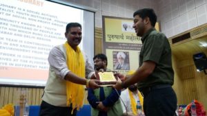 Mr Mayank Chaudhary receiving Purusharth Award